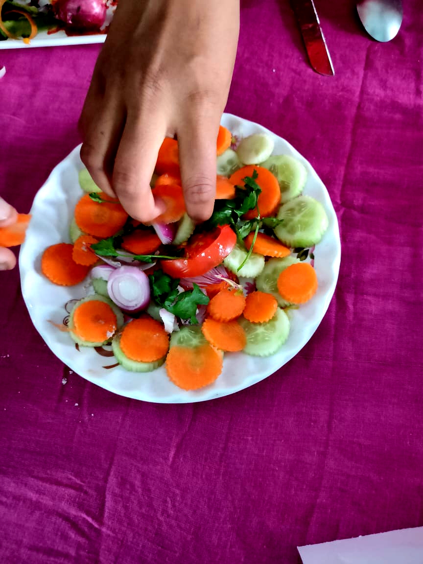 A group activity on preparation of Green Salad